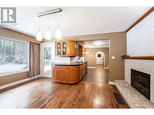 Kitchen dining area - 1557 Nichol Road, Revelstoke, BC - Indoor Photo Showing Living Room With Fireplace