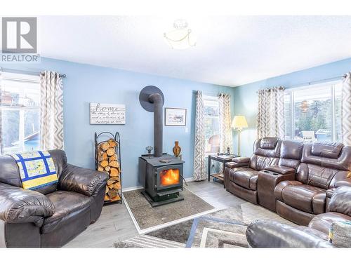 4315 Rainbow Drive, Canim Lake, BC - Indoor Photo Showing Living Room With Fireplace