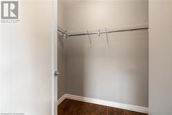 Walk in closet featuring hardwood / wood-style floors - 