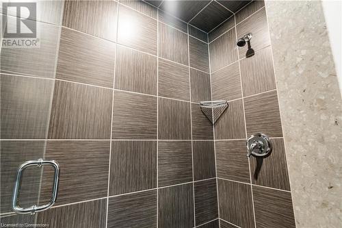 Interior details featuring a tile shower - 112 King Street E Unit# 305, Hamilton, ON - Indoor