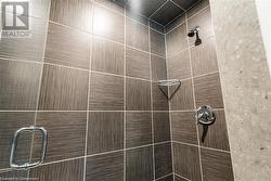 Interior details featuring a tile shower - 