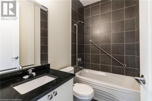 Full bathroom with vanity, toilet, and tiled shower / bath - 112 King Street E Unit# 305, Hamilton, ON - Indoor Photo Showing Bathroom