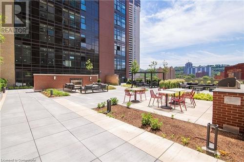 View of property's community featuring outdoor lounge area and a patio - 112 King Street E Unit# 305, Hamilton, ON - Outdoor