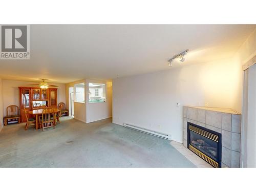 1700 2Nd Street N Unit# 115, Cranbrook, BC - Indoor Photo Showing Other Room With Fireplace