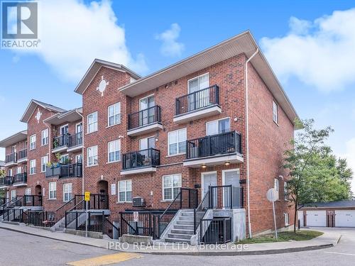 305 - 35 Strangford Lane, Toronto, ON - Outdoor With Balcony With Facade