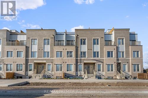 338 - 100 Honeycrisp Crescent, Vaughan, ON - Outdoor With Facade