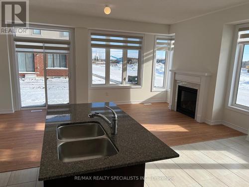 2 Prudhoe Terrace, Barrie, ON - Indoor Photo Showing Kitchen With Fireplace With Double Sink