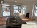 2 Prudhoe Terrace, Barrie, ON  - Indoor Photo Showing Kitchen With Fireplace With Double Sink 