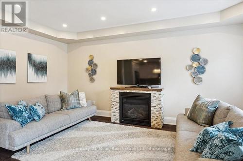 3083 Streamwood Passage, Oakville, ON - Indoor Photo Showing Living Room With Fireplace