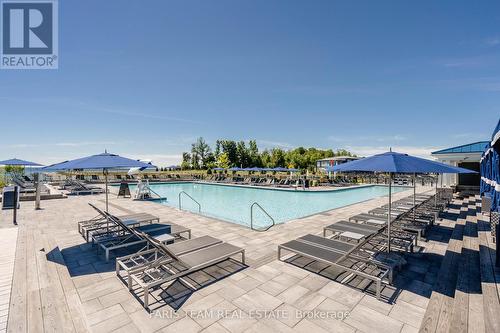 113 - 317 Broward Way, Innisfil, ON - Outdoor With In Ground Pool With View