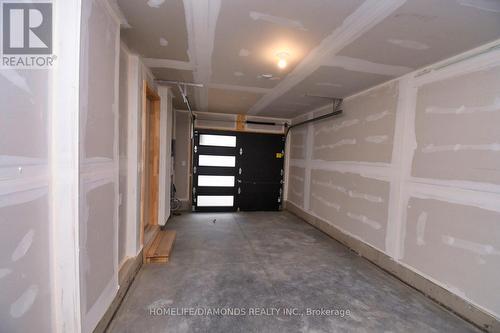 97 - 55 Tom Brown Drive, Brant, ON - Indoor Photo Showing Garage