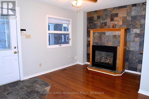 16 James Street, Kingston (East Of Sir John A. Blvd), ON - Indoor Photo Showing Other Room With Fireplace