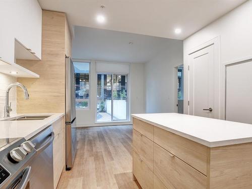 401-1628 Store St, Victoria, BC - Indoor Photo Showing Kitchen With Double Sink