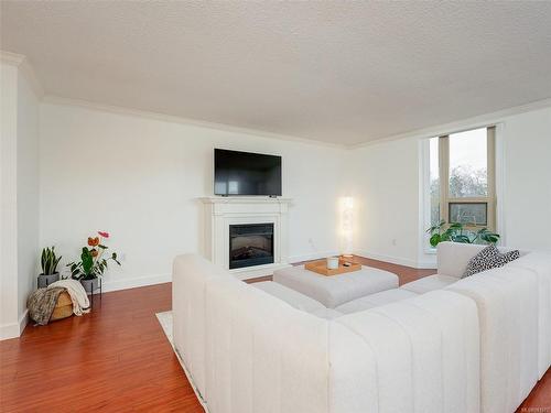 305-1545 Pandora Ave, Victoria, BC - Indoor Photo Showing Living Room With Fireplace