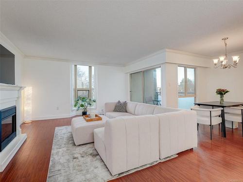 305-1545 Pandora Ave, Victoria, BC - Indoor Photo Showing Living Room With Fireplace