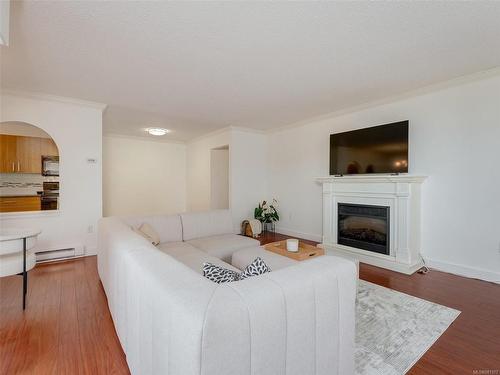 305-1545 Pandora Ave, Victoria, BC - Indoor Photo Showing Living Room With Fireplace