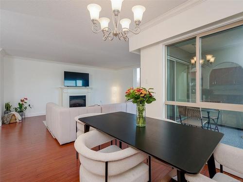 305-1545 Pandora Ave, Victoria, BC - Indoor Photo Showing Dining Room With Fireplace