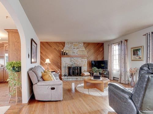 Living room - 97 Rue Beauchesne, Repentigny (Repentigny), QC - Indoor Photo Showing Living Room With Fireplace