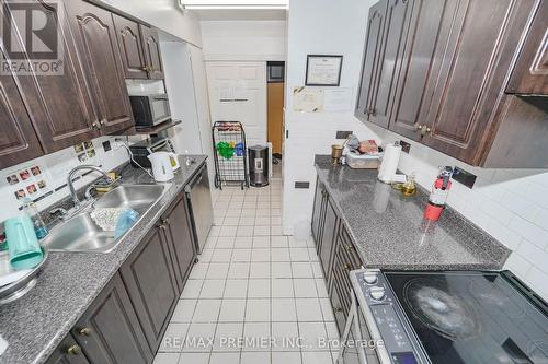 # 110 - 340 Dixon Road, Toronto, ON - Indoor Photo Showing Kitchen With Double Sink