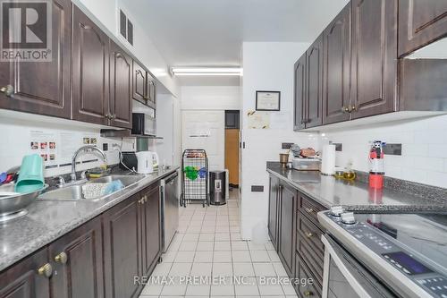 # 110 - 340 Dixon Road, Toronto, ON - Indoor Photo Showing Kitchen With Double Sink