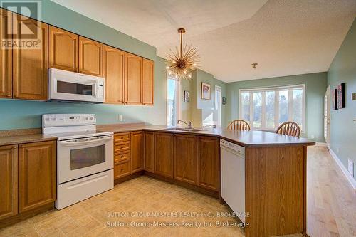 44 Country Club Drive, Loyalist (Bath), ON - Indoor Photo Showing Kitchen With Double Sink