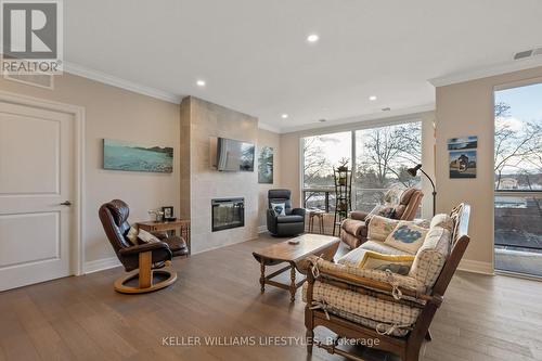 313 - 1200 Commissioners Road W, London, ON - Indoor Photo Showing Living Room With Fireplace