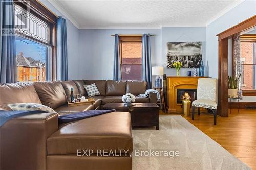 1 - 62 Burgar Street, Welland (768 - Welland Downtown), ON - Indoor Photo Showing Living Room With Fireplace