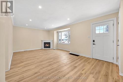 372 Flanders Row E, London, ON - Indoor With Fireplace