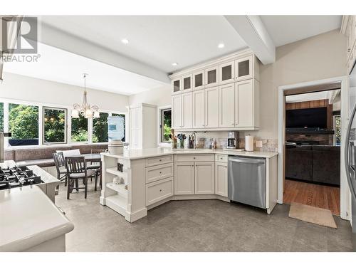 Primary Home Kitchen With Gas Range, Stone Countertops and Updated Cabinets - 1451 Mountview Road, Vernon, BC - Indoor Photo Showing Kitchen