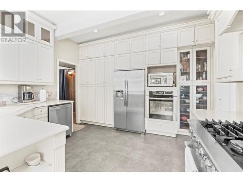 Primary Home Kitchen With Gas Range, Stone Countertops and Updated Cabinets - 1451 Mountview Road, Vernon, BC - Indoor Photo Showing Kitchen With Stainless Steel Kitchen