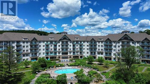 330 - 25 Pen Lake Point Road, Huntsville (Chaffey), ON - Outdoor With Balcony With Facade