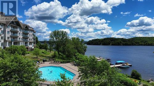 330 - 25 Pen Lake Point Road, Huntsville (Chaffey), ON - Outdoor With Body Of Water With In Ground Pool With View