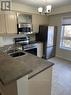 310 - 4450 Fairview Street S, Burlington, ON  - Indoor Photo Showing Kitchen With Double Sink 