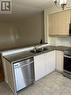 310 - 4450 Fairview Street S, Burlington, ON  - Indoor Photo Showing Kitchen With Double Sink 