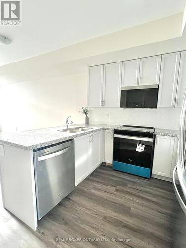 113 - 1577 Rose Way, Milton, ON - Indoor Photo Showing Kitchen With Double Sink