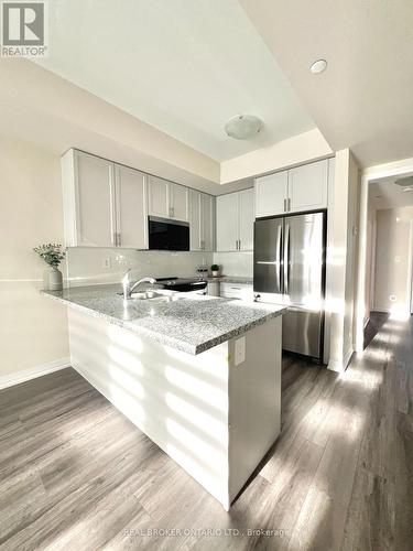 113 - 1577 Rose Way, Milton, ON - Indoor Photo Showing Kitchen With Double Sink With Upgraded Kitchen