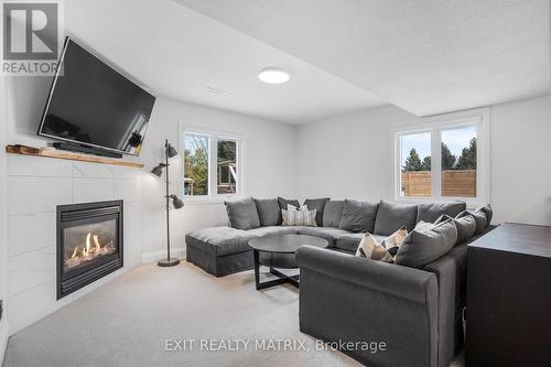 426 Sujack Street, Russell, ON - Indoor Photo Showing Living Room With Fireplace