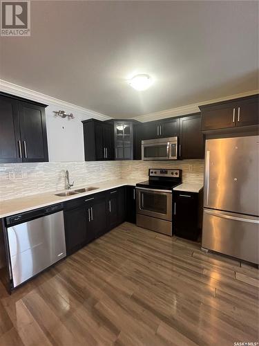 252 250 Akhtar Bend, Saskatoon, SK - Indoor Photo Showing Kitchen With Double Sink