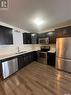 252 250 Akhtar Bend, Saskatoon, SK  - Indoor Photo Showing Kitchen With Double Sink 