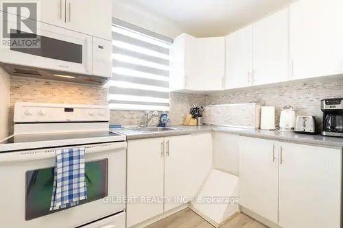 99 Reiner Road, Toronto, ON - Indoor Photo Showing Kitchen With Double Sink