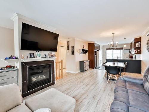 Salon - 56 Rue De L'Envol, Sainte-Anne-Des-Plaines, QC - Indoor Photo Showing Living Room With Fireplace