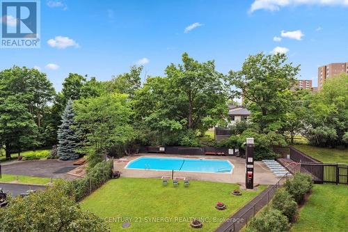 1102 - 20 Chesterton Drive, Ottawa, ON - Outdoor With In Ground Pool With Backyard