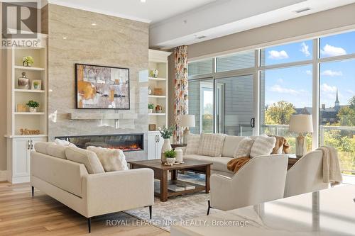 604 - 77 Yates Street, St. Catharines (Downtown), ON - Indoor Photo Showing Living Room With Fireplace