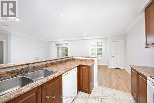 213 - 443 Centennial Forest Drive, Milton, ON - Indoor Photo Showing Kitchen With Double Sink