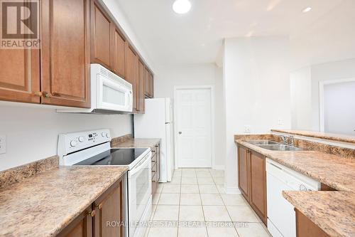 213 - 443 Centennial Forest Drive, Milton, ON - Indoor Photo Showing Kitchen With Double Sink