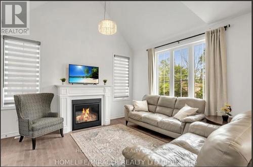 3205 Mosley Street, Wasaga Beach, ON - Indoor Photo Showing Living Room With Fireplace