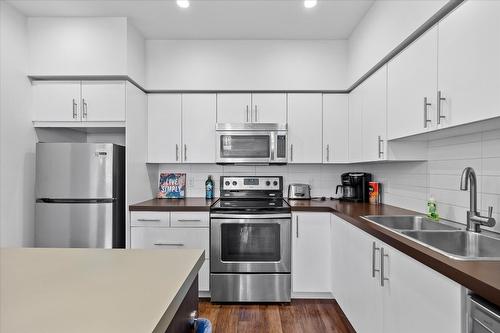 301-975 Academy Way, Kelowna, BC - Indoor Photo Showing Kitchen With Double Sink