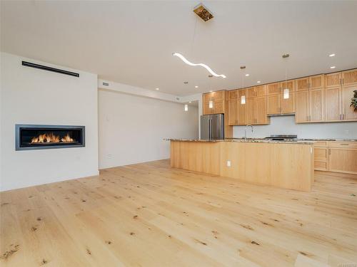 7-9667B First St, Sidney, BC - Indoor Photo Showing Kitchen With Fireplace