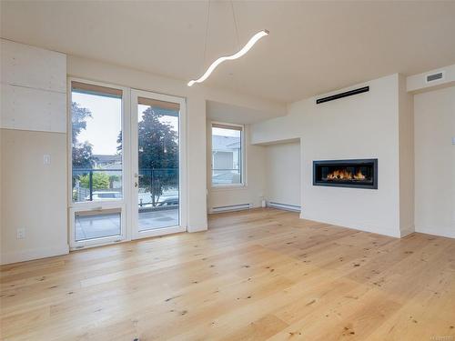 7-9667B First St, Sidney, BC - Indoor Photo Showing Other Room With Fireplace