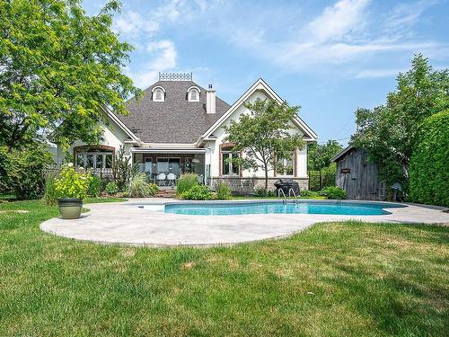 Back facade - 138 Rue Du Havre, Terrebonne (Lachenaie), QC - Outdoor With In Ground Pool